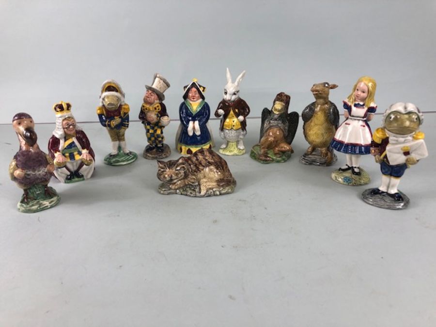 Beswick Alice series, a collection of 11 Alice in wonderland figurines by Beswick, to include,