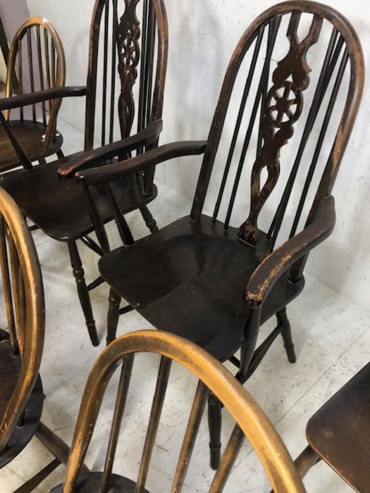 Six stick back Ercol dining chairs, and two wheel back carver chairs - Image 11 of 12