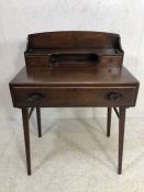 ERCOL writing desk, with a raised gallery with shelf, pigeon hole and drawers, the base with a