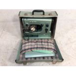 Sewing machine, vintage Hsqvarna Viking electric portable sewing machine, in case.