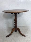 Antique furniture, Round Dark wood tilt top occasional table on turned central tripod column ,