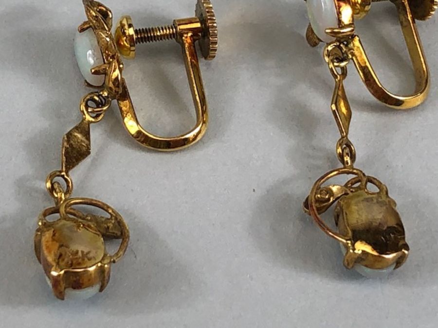 Pair of 14ct Gold drop earrings each set with two cushion cut Opals (total drop approx 32mm) - Image 12 of 13