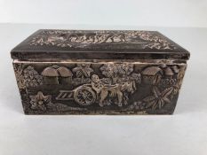 Indian white metal Box, possibly for cigarettes, heavily embossed panels depicting Indian village