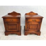 Pair of bedside cupboards in stained pine finish, cupboard with drawer above with carved