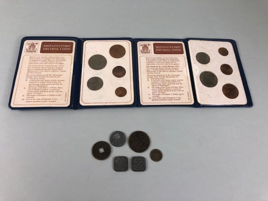 Coins, 2 sets of Britain's first decimal coins along with a silver 3d 1890, and 5 foreign coins