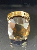 Large faceted smokey Quartz ring on pierced gold band (unmarked) the quartz stone approx 22mm x 16mm