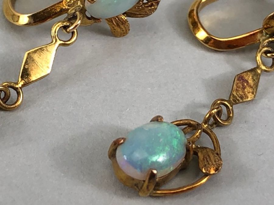 Pair of 14ct Gold drop earrings each set with two cushion cut Opals (total drop approx 32mm) - Image 9 of 13