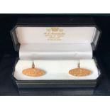 Pair of Oval 9ct Rose Gold cufflinks with floral design (total weight 10.2g) in leather case