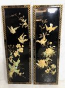 Oriental lacquered panels, two black and gold lacquered wall panels decorated with birds and flowers