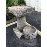Stone garden bird bath, approx 57cm tall and a garden urn-style pot