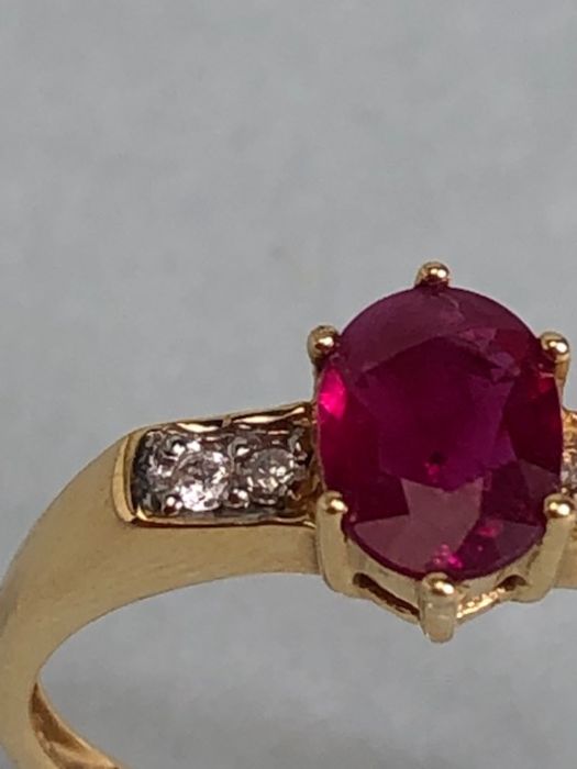 14ct Gold ring set with Oval faceted Ruby in claw setting with pair of diamonds to each shoulder - Image 3 of 7