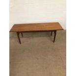 Mid century furniture, 1970s long coffee table on round tapered legs approximately 120 x 40 x 41cm