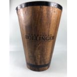 Wooden champagne cooler, with metal banding, Bollinger printed on front approximately 31 x 40cm