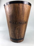 Wooden champagne cooler, with metal banding, Bollinger printed on front approximately 31 x 40cm