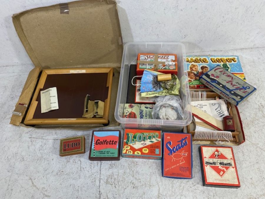 Vintage toys, a quantity of 20th century games, to include , New Footy football, Magic Robot,