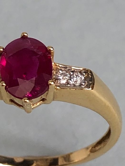 14ct Gold ring set with Oval faceted Ruby in claw setting with pair of diamonds to each shoulder - Image 4 of 7