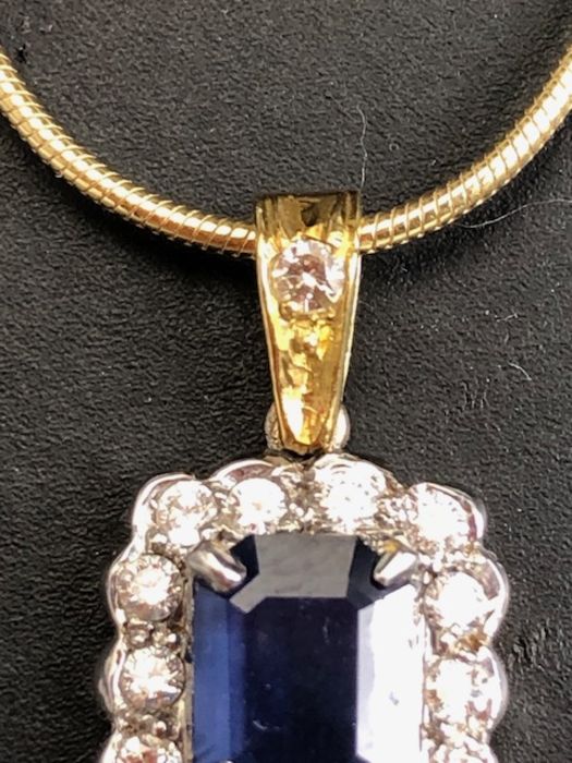 18ct sapphire and diamond pendant, cushion cut sapphire surrounded by diamonds on a rolled - Image 4 of 6