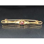 9ct Gold Garnet and seed pearl Brooch approx 5.5cm in length and 2.6g