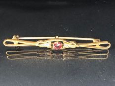 9ct Gold Garnet and seed pearl Brooch approx 5.5cm in length and 2.6g