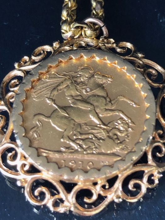 A 1910 Full Gold sovereign in a pierced and scrolling style mount on a Long 9ct Gold chain (approx - Image 4 of 8