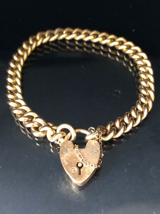 9ct Gold curb link bracelet with 9ct Gold heart shaped clasp and safety chain approx 16cm in