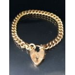 9ct Gold curb link bracelet with 9ct Gold heart shaped clasp and safety chain approx 16cm in