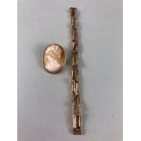 Gold Jewellery, 9ct rose gold watch strap approximately 7.80g and a 9ct gold mounted shell cameo.