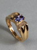 14ct Gold contemporary ring set with a Oval Tanzanite (approx 6mm x 4mm) in four claw setting size