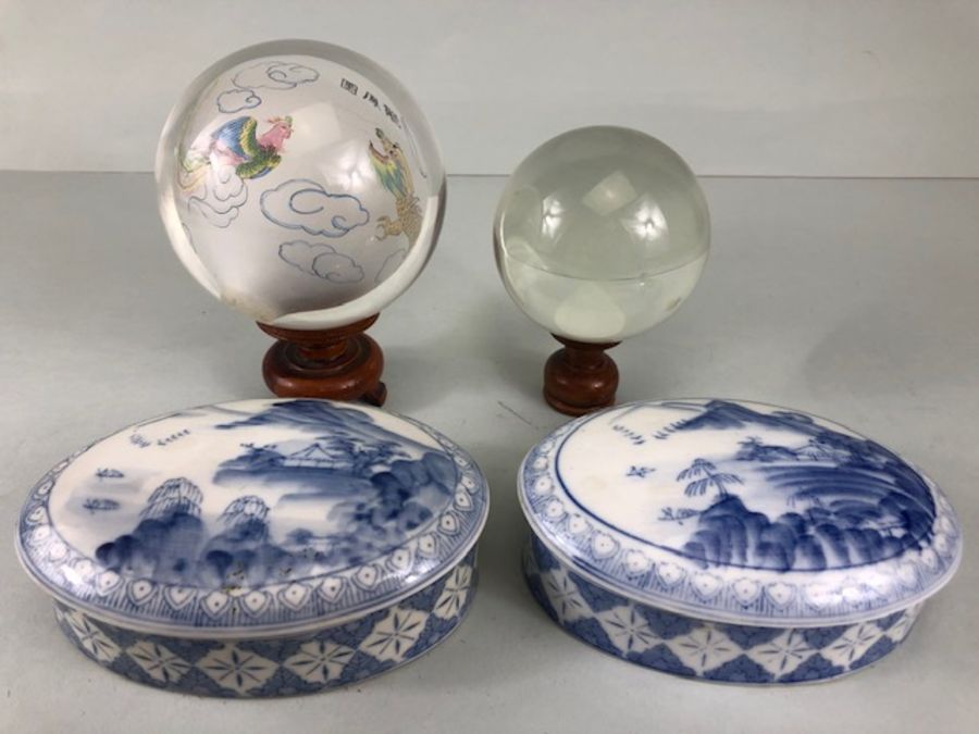 Chinese Art, Two Blue and white ceramic oval shaped pots with geometric patterns the lids with