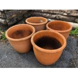 Four matching circular Terracotta planters/pots each approx 28cm tall