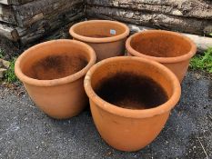 Four matching circular Terracotta planters/pots each approx 28cm tall