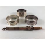 Hallmarked silver items to include napkin rings and a silver hallmarked propelling pencil (4)