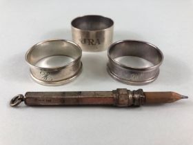 Hallmarked silver items to include napkin rings and a silver hallmarked propelling pencil (4)