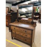 Antique furniture, early 20th century dark wood dressing table with swivel mirror, base with run