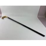 Silver mounted walking stick, polished horn handle on ebonised sick with hallmarked silver collar,
