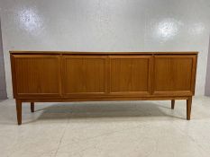 Mid century furniture, 1970s long sideboard, on splayed legs comprising of a 2 door central