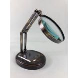 Scientific style magnifying glass on adjustable metal stand with wooden base approximately 28ch