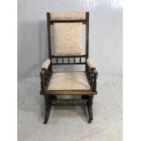 Antique Furniture, American Rocking Chair in dark wood upholstered in modern brocade fabric, casters