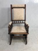Antique Furniture, American Rocking Chair in dark wood upholstered in modern brocade fabric, casters