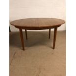 20th century furniture, Oval extending dining table on square tapered legs with flip out centre