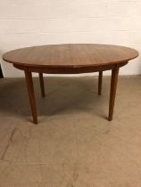 20th century furniture, Oval extending dining table on square tapered legs with flip out centre