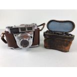 Vintage Kodak Retinette 1B Pronator 500LX 35mm Camera in its case, and a pair of opera glasses in