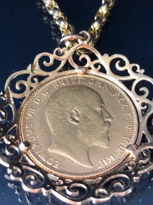 A 1910 Full Gold sovereign in a pierced and scrolling style mount on a Long 9ct Gold chain (approx - Image 3 of 8