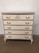 Mid century furniture, chest of 5 drawers in off white finish with wreath design mouldings, and