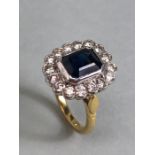 18ct yellow gold cluster ring ,cushion cut sapphire surrounded by diamonds mounted on a 18ct