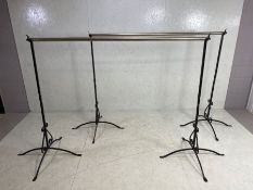 Wrought Iron Rails, a pair of modern clothes hanging rails, the uprights of wrought iron in the