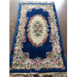 Oriental Rug, Chinese wool rug with pattern of sculpted flowers on a Blue back ground