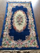 Oriental Rug, Chinese wool rug with pattern of sculpted flowers on a Blue back ground