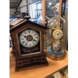 Antique clocks, a brass clock with enamel dial by Gustav Becker under glass dome and a wooden