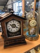 Antique clocks, a brass clock with enamel dial by Gustav Becker under glass dome and a wooden